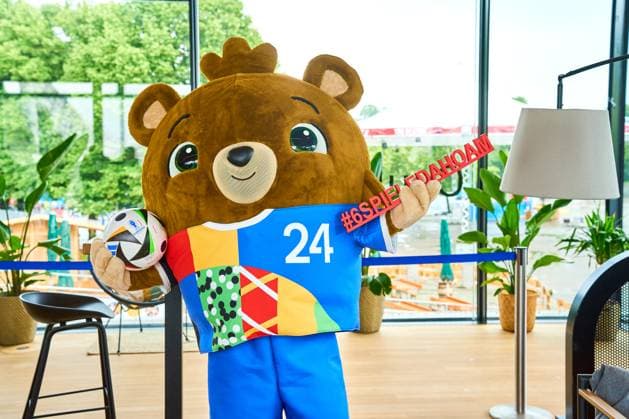 Munich, Bavaria, Germany - June 3, 2024: The official mascot of UEFA EURO, EM, Europameisterschaft,Fussball 2024 Albärt poses with the football love ball at a press event in the Olympic Park in Munich