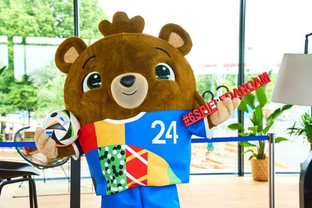 Munich, Bavaria, Germany - June 3, 2024: The official mascot of UEFA EURO, EM, Europameisterschaft,Fussball 2024 Albärt poses with the football love ball at a press event in the Olympic Park in Munich