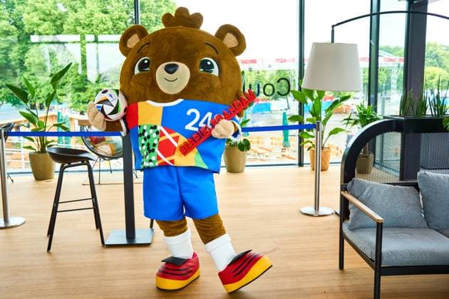 Munich, Bavaria, Germany - June 3, 2024: The official mascot of UEFA EURO, EM, Europameisterschaft,Fussball 2024 Albärt poses with the football love ball at a press event in the Olympic Park in Munich