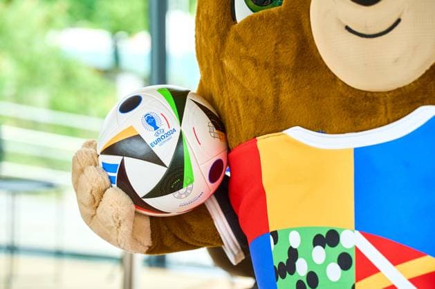 Munich, Bavaria, Germany - June 3, 2024: The official mascot of UEFA EURO, EM, Europameisterschaft,Fussball 2024 Albärt poses with the football love ball at a press event in the Olympic Park in Munich