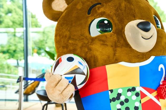Munich, Bavaria, Germany - June 3, 2024: The official mascot of UEFA EURO, EM, Europameisterschaft,Fussball 2024 Albärt poses with the football love ball at a press event in the Olympic Park in Munich