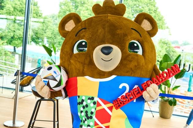 Munich, Bavaria, Germany - June 3, 2024: The official mascot of UEFA EURO, EM, Europameisterschaft,Fussball 2024 Albärt poses with the football love ball at a press event in the Olympic Park in Munich