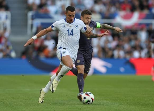 Newcastle Upon Tyne, England, 3rd June 2024. Kieran Trippier (R) of England in action with Dario Saric of Bosnia-Herzegovina during the International Friendly, Länderspiel, Nationalmannschaft match between England and Bosnia-Herzegovina at St. James Park, Newcastle Upon Tyne. Picture credit should read: Nigel Roddis Sportimage EDITORIAL USE ONLY. No use with unauthorised audio, video, data, fixture lists, club league logos or live services. Online in-match use limited to 120 images, no video emulation. No use in betting, games or single club league player publications. SPI-3178-0009