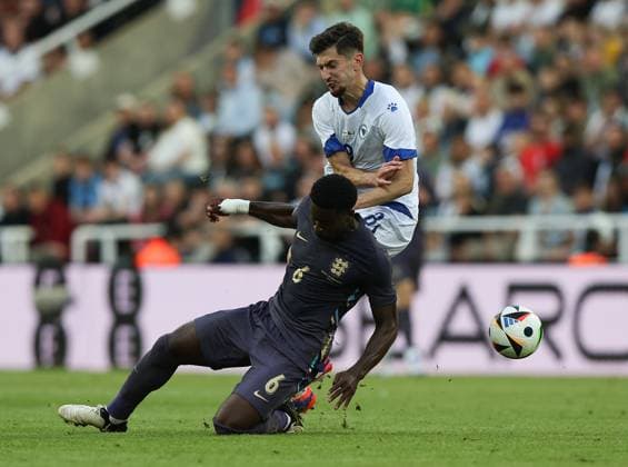 Newcastle Upon Tyne, England, 3rd June 2024. Marc Guehi (L) of England in action with Armin Gigovic of Bosnia-Herzegovina during the International Friendly, Länderspiel, Nationalmannschaft match between England and Bosnia-Herzegovina at St. James Park, Newcastle Upon Tyne. Picture credit should read: Nigel Roddis Sportimage EDITORIAL USE ONLY. No use with unauthorised audio, video, data, fixture lists, club league logos or live services. Online in-match use limited to 120 images, no video emulation. No use in betting, games or single club league player publications. SPI-3178-0011