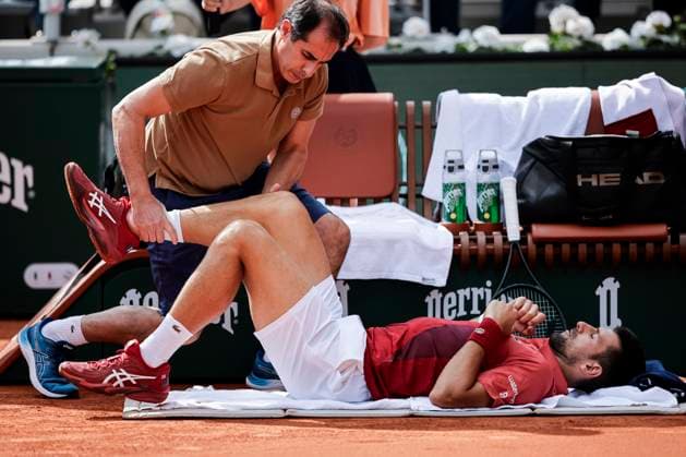 Novak Djokovic of Serbia is assisted by Doctor prior his match against Francisco Cerundolo of Argentina during the Men™s Singles Round of 16 of 2024 French Open - Day 9 at Roland Garros on June 3, 2024 in Paris, France. (Photo by JustPictures) Paris Roland Garros France