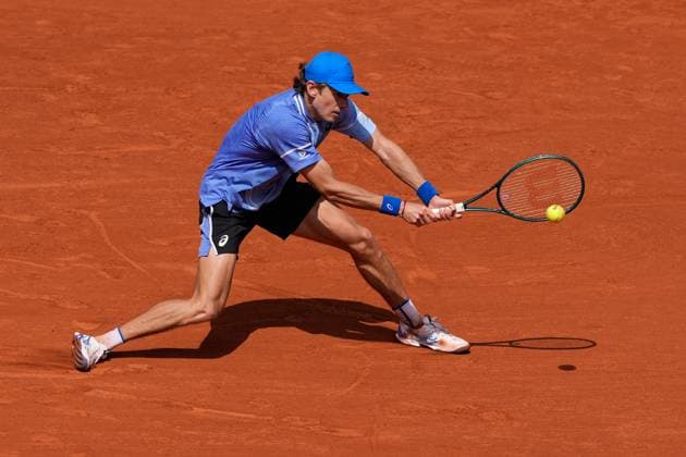 (240604) -- PARIS, June 4, 2024 -- Alex de Minaur hits a return during the men s singles fourth round match between Daniil Medvedev of Russia and Alex de Minaur of Australia at the French Open tennis tournament at Roland Garros in Paris, France, June 3, 2024. ) (SP)FRANCE-PARIS-TENNIS-FRENCH OPEN-MEN S SINGLES MengxDingbo 