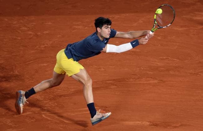 Carlos Alcaraz of Spain plays against Stefanos Tsitsipas of Greece during their quarter final match of the French Tennis Open at Roland Garros in Paris, France, on Tuesday, June 4, 2024. Alcaraz won 6-3, 7-6, 6-4.  PAR20240604134 MAYAxVIDON-WHITE