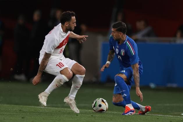 Bologna, Italy, 4th June 2024. Mattia Zaccagni of Italy turns Hakan Calhanoglu of Turkey during the International Friendly, Länderspiel, Nationalmannschaft match at Stadio Renato Dall Ara, Bologna. Picture credit should read: Jonathan Moscrop Sportimage EDITORIAL USE ONLY. No use with unauthorised audio, video, data, fixture lists, club league logos or live services. Online in-match use limited to 120 images, no video emulation. No use in betting, games or single club league player publications. SPI-3179-0067