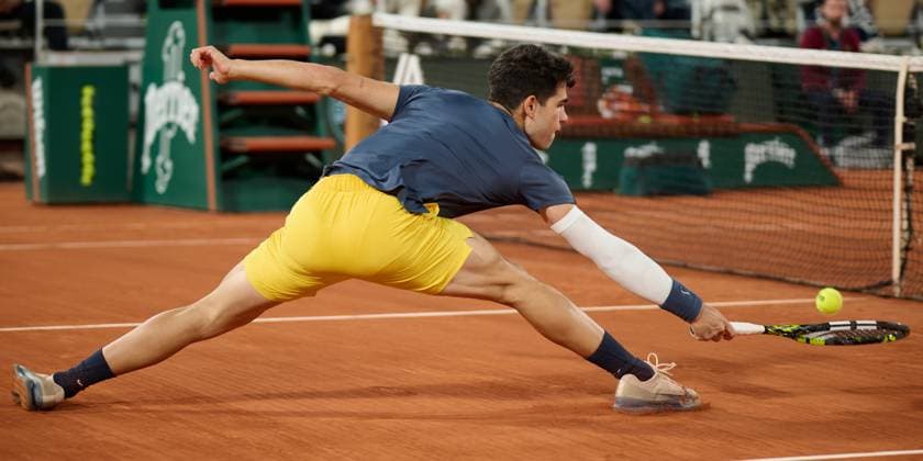 (240605) -- PARIS, June 5, 2024 -- Carlos Alcaraz hits a return during the men s singles quarterfinal match between Carlos Alcaraz of Spain and Stefanos Tsitsipas of Greece at the French Open tennis tournament at Roland Garros, Paris, France, June 4, 2024. ) (SP)FRANCE-PARIS-TENNIS-FRENCH OPEN-MEN S SINGLES MengxDingbo 
