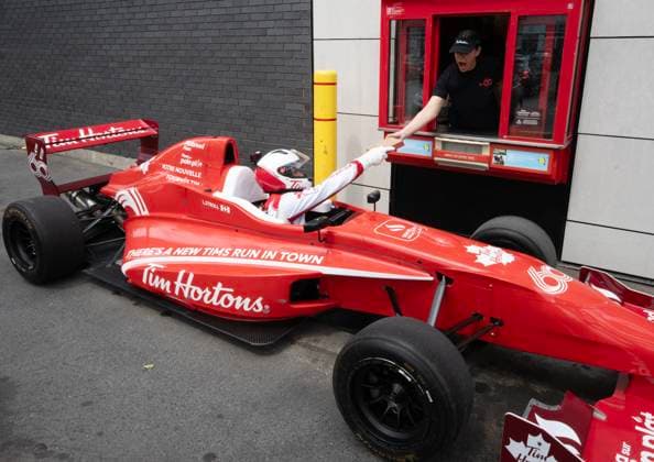 June 5, 2024, Montreal, Pq, Canada: Aston Martin Formula One driver Lance Stroll, from Canada, goes through the drive-through during the filming of a Tim Hortons commercial ahead of the Canadian Grand Prix, in Montreal, Wednesday, June 5, 2024. Lance Stroll, - ZUMAc35_ 20240605_zaf_c35_051 Copyright: xRyanxRemiorzx
