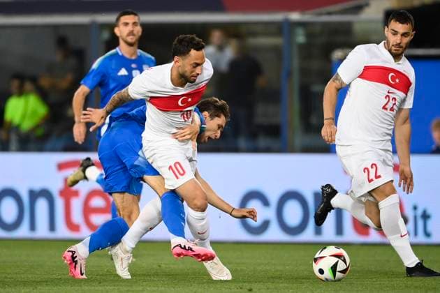 4th June 2024; Stadio Renato Dall Ara, Bologna, Italy; International Football Friendly, Italy versus Turkey; (L-R) Hakan Calhanoglu of Turkey challenged by Federico Chiesa of Italy  ActionPlus12651149 BestxImages