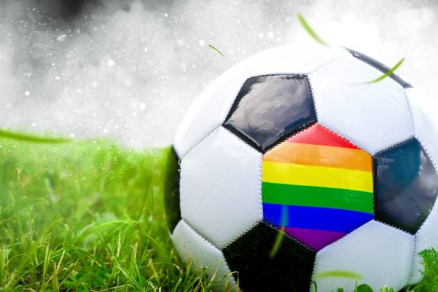 6 June 2024: Football with rainbow flag, symbolic image of sexual identity in professional soccer. PHOTOMONTAGE