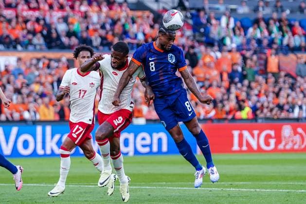 2024-06-06 Netherlands v Canada - Friendly International ROTTERDAM, NETHERLANDS - JUNE 6: Georginio Wijnaldum of Netherlands competes for the headed ball with Cyle Larin of Canada during the Friendly international match, Länderspiel, Nationalmannschaft between Netherlands and Canada at Stadion Feijenoord de Kuip on June 6, 2024 in Rotterdam, Netherlands. (Photo by Andre Weening BSR Agency) Rotterdam Netherlands Content not available for redistribution in The Netherlands directly or indirectly through any third parties. Copyright: xBSRxAgencyx
