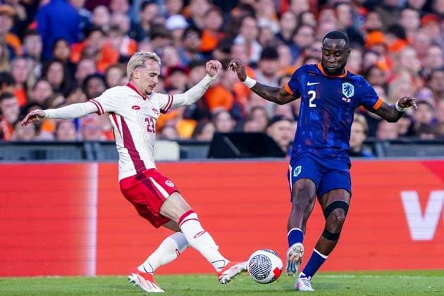 2024-06-06 Netherlands v Canada - Friendly International ROTTERDAM, NETHERLANDS - JUNE 6: Liam Millar of Canada battles for the ball with Lutsharel Geertruida of Netherlands during the Friendly international match, Länderspiel, Nationalmannschaft between Netherlands and Canada at Stadion Feijenoord de Kuip on June 6, 2024 in Rotterdam, Netherlands. (Photo by Andre Weening BSR Agency) Rotterdam Netherlands Content not available for redistribution in The Netherlands directly or indirectly through any third parties. Copyright: xBSRxAgencyx