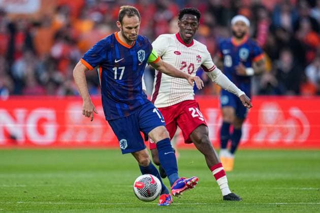 2024-06-06 Netherlands v Canada - Friendly International ROTTERDAM, NETHERLANDS - JUNE 6: Daley Blind of Netherlands, Jonathan David of Canada battle for the ball during the Friendly international match, Länderspiel, Nationalmannschaft between Netherlands and Canada at Stadion Feijenoord de Kuip on June 6, 2024 in Rotterdam, Netherlands. (Photo by Patrick Goosen BSR Agency) Rotterdam Netherlands Content not available for redistribution in The Netherlands directly or indirectly through any third parties. Copyright: xBSRxAgencyx