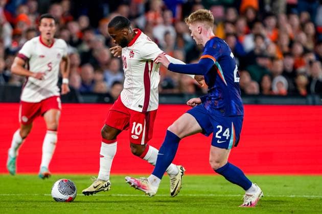2024-06-06 Netherlands v Canada - Friendly International ROTTERDAM, NETHERLANDS - JUNE 6: Junior Hoilett of Canada is challenged by Jerdy Schouten of Netherlands during the Friendly international match, Länderspiel, Nationalmannschaft between Netherlands and Canada at Stadion Feijenoord de Kuip on June 6, 2024 in Rotterdam, Netherlands. (Photo by Andre Weening BSR Agency) Rotterdam Netherlands Content not available for redistribution in The Netherlands directly or indirectly through any third parties. Copyright: xBSRxAgencyx