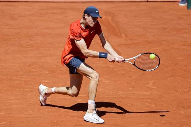 Jannik Sinner of Italy plays a backhand against Carlos Alcaraz of Spain during the Men™s Singles Semi Finals of 2024 French Open - Day 13 at Roland Garros on June 7, 2024 in Paris, France. (Photo by JustPictures) Paris Roland Garros France