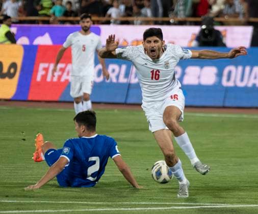 Iran v Uzbekistan - FIFA 2026 Qualifiers Iran s Mahdi Torabi (16) is reacting while Uzbekistan s Abdukodir Khusanov (2) is lying on the pitch during the FIFA World Cup, WM, Weltmeisterschaft, Fussball 26 AFC qualifying round two group E soccer match at the Azadi (Freedom) Stadium in Tehran, Iran, on June 11, 2024. Tehran Tehran Iran  Copyright: xMortezaxNikoubazlx originalFilename:nikoubazl-iranvuzb240611_npm2N.jpg