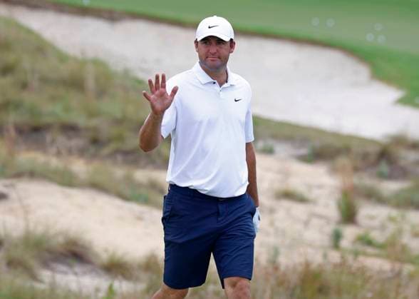 World number one golfer Scottie Scheffler waves to the gallery during a practice round at the 124th U.S. Open golf championship at Pinehurst Resort & Country Club in Pinehurst, N.C. on Wednesday, June 12, 2024.  NCP20240612109 JOHNxANGELILLO