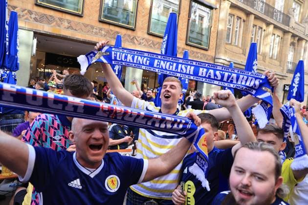 Football - UEFA EURO, EM, Europameisterschaft,Fussball 2024 - Previews 13th June 2024 - UEFA EURO 2024 - Previews - Scotland fans hold scarves aloft aimed at England - Photo: Simon Stacpoole Offside. Munich Germany Copyright: xSimonxStacpoolexOffside