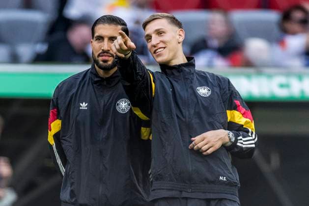 UEFA EURO 2024: Eröffnungsspiel Deutschland - Schottland; 14.06.2024 Nico Schlotterbeck (Deutschland, 15) zeigt Emre Can (Deutschland, 25) etwas. UEFA EURO 2024: Eröffnungsspiel Deutschland - Schottland; Munich Football Arena, München am 14.06.2024 Copyright: xBEAUTIFULxSPORTS Wunderlx