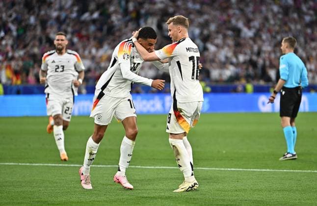 14.06.2024, xscotx, Fussball EM 2024, Deutschland - Schottland, emspor, v.l. Jamal Musiala (Deutsche Fussball Nationalmannschaft DFB) celebrate the goal, Der Torjubel zum 2:0, Maximilian Mittelstädt (Deutsche Fussball Nationalmannschaft DFB) München