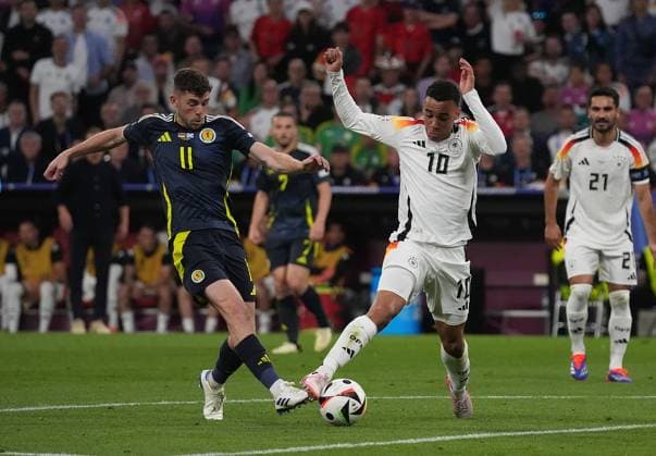 14.06.2024, Allianz-Arena, Munich, GER, EM UEFA 2024, Group A, Germany vs Scotland, im Bild Ryan Christie (Scottland 11) , Jamal Musiala (Germany 10) Defodi-506_20240614_hbr_2045