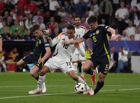 GER, EM UEFA 2024, Group A, Germany vs Scotland 14.06.2024, Allianz-Arena, Munich, GER, EM UEFA 2024, Group A, Germany vs Scotland, im Bild Ryan Christie (Scottland 11) , Jamal Musiala (Germany 10) , Kieran Tierney (Scottland 6)