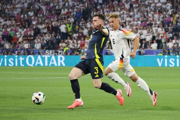 14.06.2024, Fussball, Herren, UEFA Europameisterschaft 2024, Eröffnungsspiel, Gruppe A, Deutschland - Schottland, Joshua Kimmich (Deutschland), Andrew Robertson (Schottland) München Allianz Arena Bayern Deutschland (DE) Copyright: xSebastianxBachx