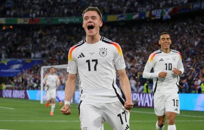 BAU 14.06.2024 München Fußball EM 2024 Eröffnungsspiel Deutschland vs. Schottland, v.l. Torschütze Florian Wirtz (GER) jubelt über das Tor zum 1:0, rechts Jamal Musiala (GER)