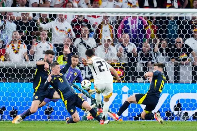 Germany v Scotland: Group A - UEFA EURO, EM, Europameisterschaft,Fussball 2024 Ilkay Gundogan central midfield of Germany and FC Barcelona, Barca shooting to goal during the UEFA EURO 2024 group stage match between Germany and Scotland at Munich Football Arena on June 14, 2024 in Munich, Germany. Munich Germany  Copyright: xJosexBretonx originalFilename:breton-germanyv240614_np7zq.jpg