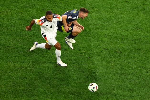 Ryan Christie of Scotland is challenged by Jonathan Tah of Germany Germany v Scotland, UEFA European Championship, EM, Europameisterschaft 2024, Group A, Football, Munich Football Arena, Munich, Germany, 14 Jun 2024 EDITORIAL USE ONLY No use with unauthorised audio, video, data, fixture lists, club league logos or live services. Online in-match use limited to 120 images, no video emulation. No use in betting, games or single club league player publications.  Copyright: xKieranxMcManus Shutterstockx 14523770cq