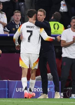 Munich, Germany, 14th June 2024. Julian Nagelsmann coach of Germany hugs Kai Havertz of Germany during the UEFA European Championships match at Allianz Arena, Munich. Picture credit should read: David Klein Sportimage EDITORIAL USE ONLY. No use with unauthorised audio, video, data, fixture lists, club league logos or live services. Online in-match use limited to 120 images, no video emulation. No use in betting, games or single club league player publications. SPI-3194-0109