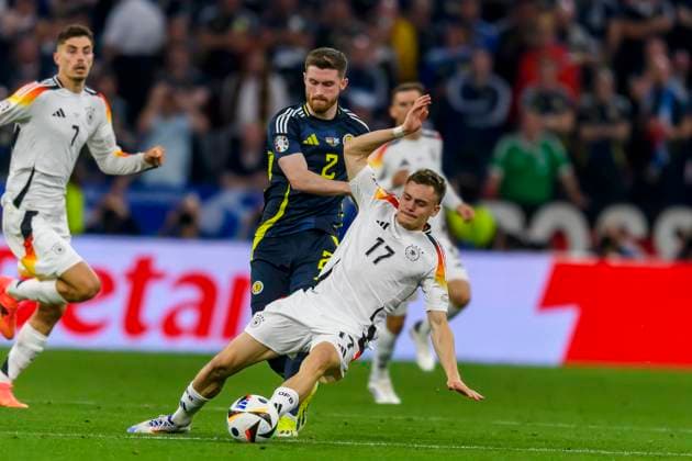 GER, UEFA Euro 2024, Gruppe A, Deutschland (GER) vs Schottland (SCO) 14.06.2024, Allianz Arena, Muenchen, GER, UEFA Euro 2024, Gruppe A, Deutschland (GER) vs Schottland (SCO) , im Bild Tony Ralston (Scottland 2) im Zweikampf gegen Florian Wirtz (Germany 17)