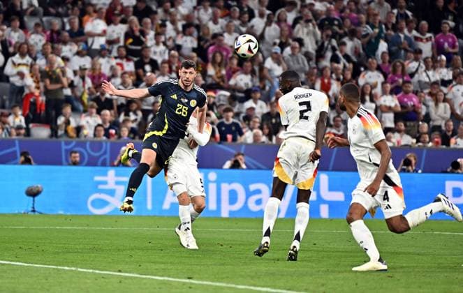 14.06.2024, xscotx, Fussball EM 2024, Deutschland - Schottland, emspor, v.l. Scott Fraser Mckenna (Team Schottland), Antonio Rüdiger (Deutsche Fussball Nationalmannschaft DFB) Goal scored, erziehlt das Tor zum 4:1 für schottland eigentor München