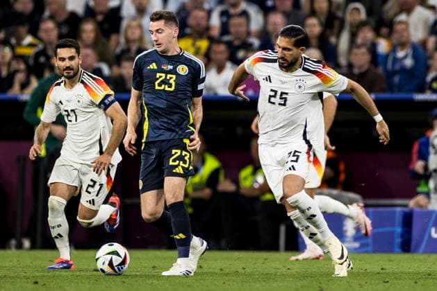 UEFA EURO 2024: Eröffnungsspiel Deutschland - Schottland; 14.06.2024 Kenneth McLean (Schottland, 23), Emre Can (Deutschland, 25). UEFA EURO 2024: Eröffnungsspiel Deutschland - Schottland; Munich Football Arena, München am 14.06.2024 Copyright: xBEAUTIFULxSPORTS Wunderlx