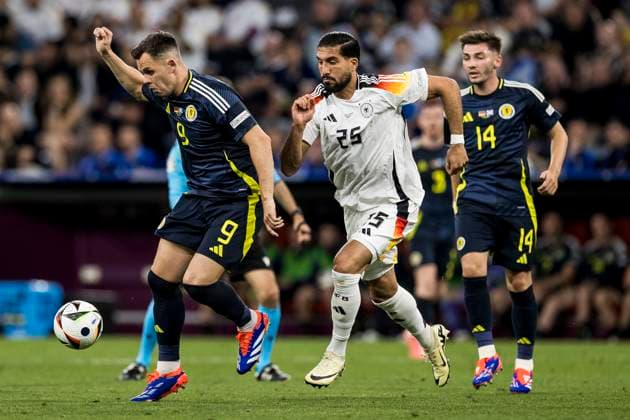 UEFA EURO 2024: Eröffnungsspiel Deutschland - Schottland; 14.06.2024 Lawrence Shankland (Schottland, 9), Emre Can (Deutschland, 25). UEFA EURO 2024: Eröffnungsspiel Deutschland - Schottland; Munich Football Arena, München am 14.06.2024 Copyright: xBEAUTIFULxSPORTS Wunderlx