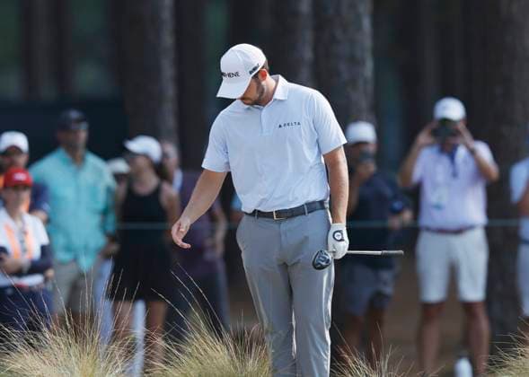 Patrick Cantlay reacts after trying to chip to the green on the twelfth fairway during the second round of the 124th U.S. Open golf championship at Pinehurst Resort & Country Club in Pinehurst, N.C. on Friday, June 14, 2024.  NCP20240614781 JOHNxANGELILLO