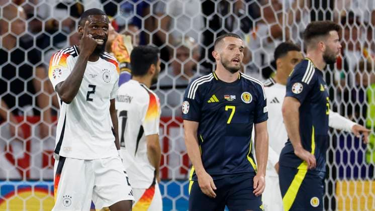 14.06.2024, Fussball, Europameisterschaft, Germany - Scotland, GER, Munich, Munich Football Arena, Bild: v. li. Antonio Ruediger (Germany, 2) und John McGinn (Scotland, 7). Copyright: HMBxMedia xHeikoxBecker