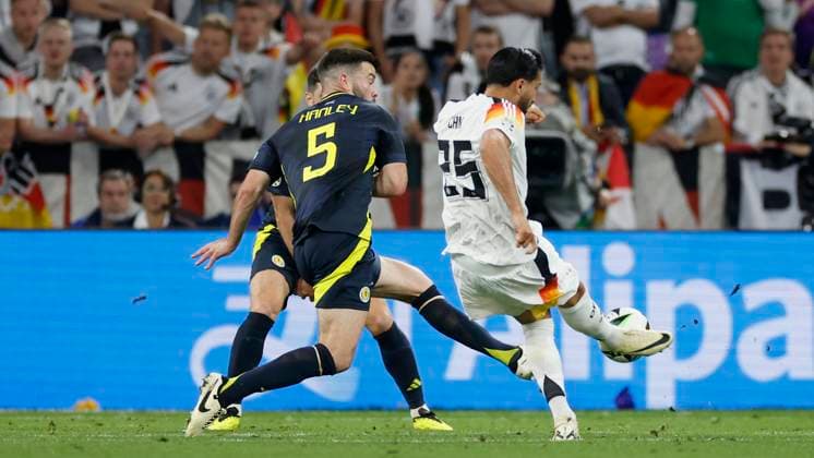 14.06.2024, Fussball, Europameisterschaft, Germany - Scotland, GER, Munich, Munich Football Arena, Bild: v. li. Grant Hanley (Scotland, 5) kommt zu spät, Emre Can (Germany, 25) Goal scored, erziehlt das Tor zum 5:1, celebrate the goal Copyright: HMBxMedia xHeikoxBecker