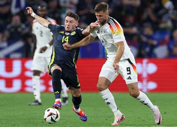 Billy Gilmour of Scotland (L) battles with Niclas Füllkrug of Germany (R) Germany v Scotland, UEFA European Championship, EM, Europameisterschaft 2024, Group A, Football, Munich Football Arena, Munich, Germany, 14 Jun 2024 EDITORIAL USE ONLY No use with unauthorised audio, video, data, fixture lists, club league logos or live services. Online in-match use limited to 120 images, no video emulation. No use in betting, games or single club league player publications. Copyright: xPaulxCurrie Shutterstockx 14523776mb