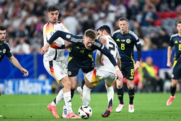 EM 2024: Deutschland - Schottland am 14.06.2024 in der Allianz Arena in München Kai Havertz (Deutschland) im Zweikampf gegen Scott McTominay of Scotland und Ilkay Gündogan Guendogan (Deutschland)