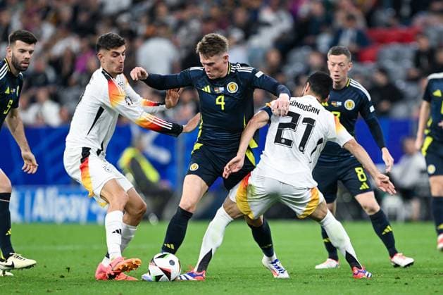 EM 2024: Deutschland - Schottland am 14.06.2024 in der Allianz Arena in München Kai Havertz (Deutschland) im Zweikampf gegen Scott McTominay of Scotland und Ilkay Gündogan Guendogan (Deutschland)