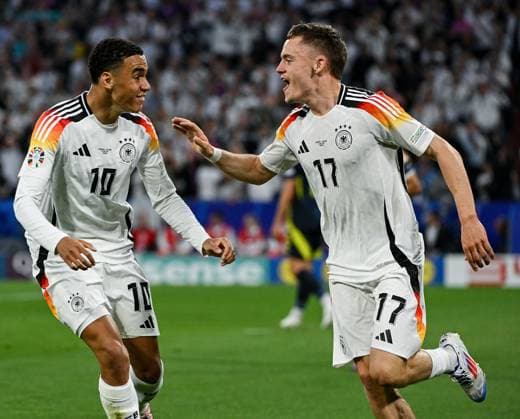 14.06.2024, xpsx, UEFA EURO, EM, Europameisterschaft,Fussball 2024 Vorrunde, Deutschland - Schottland v.l. celebrate the goal, Torjubel zum 1:0 Torschüttze Florian Wirtz (Deutsche Fussball Nationalmannschaft DFB), Jamal Musiala (Deutsche Fussball Nationalmannschaft DFB) (DFL DFB REGULATIONS PROHIBIT ANY USE OF PHOTOGRAPHS as IMAGE SEQUENCES and or QUASI-VIDEO) München Bayern Deutschland (DEU)