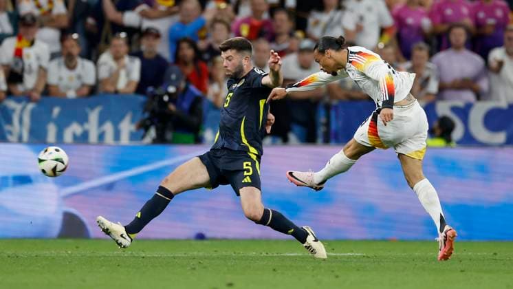 14.06.2024, Fussball, Europameisterschaft, Germany - Scotland, GER, Munich, Munich Football Arena, Bild: v. li. Grant Hanley (Scotland, 5) und Leroy Sane (Germany, 19), Copyright: HMBxMedia xHeikoxBecker