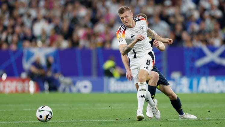 14.06.2024, Fussball, Europameisterschaft, Germany - Scotland, GER, Munich, Munich Football Arena, Bild: v. li. Ryan Christie (Scotland, 11) und Toni Kroos (Germany, 8) Copyright: HMBxMedia xHeikoxBecker