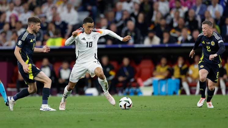 14.06.2024, Fussball, Europameisterschaft, Germany - Scotland, GER, Munich, Munich Football Arena, Bild: v. li. Ryan Christie (Scotland, 11), Jamal Musiala (Germany, 10) und Callum McGregor (Scotland, 8), Copyright: HMBxMedia xHeikoxBecker