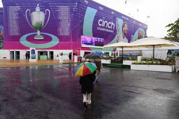 15th June 2024; Cinch Championships, Queens Club, West Kensington, London, England: Cinch Championships Queens Club, Qualifying Day 1; Spectators running for cover due to heavy rain in the grounds  ActionPlus12654648 JohnxPatrickxFletcher