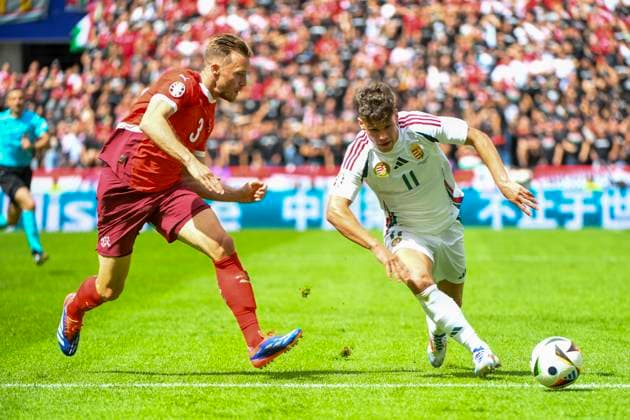 COLOGNE, GERMANY - JUNE 15: Milos Kerkez of Hungary (R) against Silvan Widmer of Switzerland (L) during the UEFA EURO, EM, Europameisterschaft,Fussball 2024 group stage match between Hungary and Switzerland at Cologne Stadium on June 15, 2024 in Cologne, Germany. Cologne Cologne Stadium North Rhine-Westphalia Germany Copyright: xJustPictures.ch ManuelxWinterbergerx jp-en-EuSpIm-MWI_7705