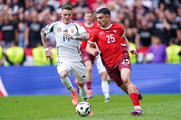2024-06-15 Hungary v Switzerland - Group A - UEFA EURO, EM, Europameisterschaft,Fussball 2024 COLOGNE, GERMANY - JUNE 15: Bendeguz Bolla of Hungary, Mohamed Zeki Amdouni of Switzerland battle for the ball during the Group A - UEFA EURO 2024 match between Hungary and Switzerland at Cologne Stadium on June 15, 2024 in Cologne, Germany. (Photo by Joris Verwijst BSR Agency) Cologne Germany Content not available for redistribution in The Netherlands directly or indirectly through any third parties. Copyright: xBSRxAgencyx